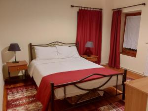 Postel nebo postele na pokoji v ubytování Traditional Guesthouse Vrigiis