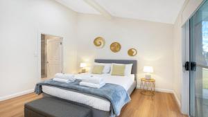 a bedroom with a bed with two pillows on it at Sutton Forest Retreat The Hideaway in Sutton Forest