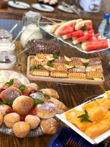a table topped with lots of different types of food at Kamar Hotel Ijevan in Ijevan