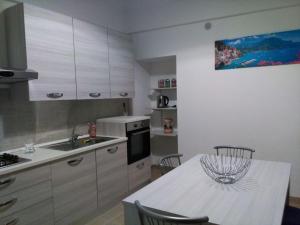 a kitchen with a table with a bowl on it at DonVito Casa Vacanze in Alberobello