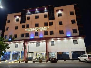 a building with a sign on the front of it at Karam Al Diyafa Hotel in Jeddah