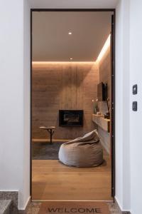 a door leading into a living room with a bean bag chair at Suite Mia in Falcade