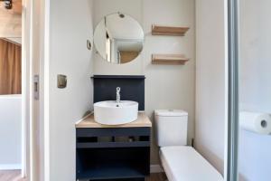 a bathroom with a sink and a mirror at Campeggio Amici di Lazise in Lazise +67 photos