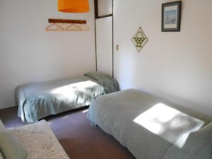 Postel nebo postele na pokoji v ubytování Villa Nugget Inn