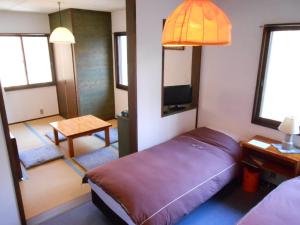 Postel nebo postele na pokoji v ubytování Villa Nugget Inn