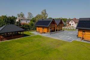 an aerial view of a house with solar panels on it at Domki przy Alei in Krasnobród