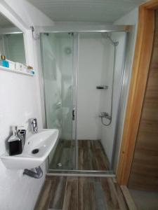 a bathroom with a shower and a sink at Alaçatı La Vista in Alacati
