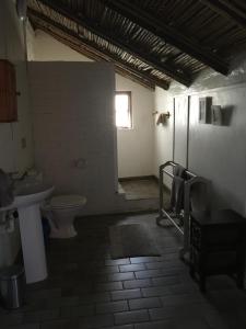 a bathroom with a toilet and a sink at Maylodge Country Cottages in Hogsback