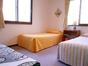 Ένα ή περισσότερα κρεβάτια σε δωμάτιο στο Pension Nugget Inn