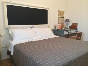 Posteľ alebo postele v izbe v ubytovaní B&B Giovannarolla Green House
