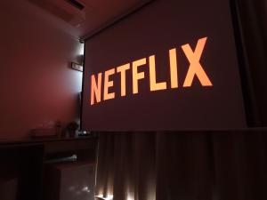 a netflix sign on a wall in a room at OYO Hostel Myeongdong 2 in Seoul +36 photos