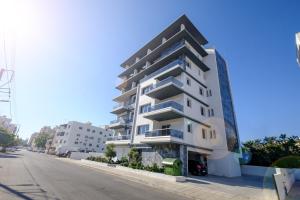 an apartment building on the side of a street at Solaar Apartments Faneromeni in Larnaca