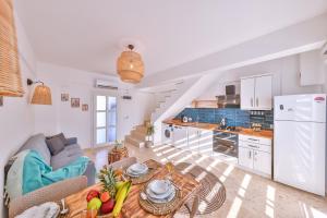 a kitchen and living room with a couch and a table at Villa Ay in Kas