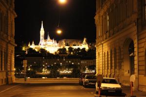 a view of a city at night with a building at Parliment Luxury Apartment in Budapest