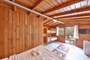 a room with wooden walls and a bed in a room at Olympos Mocamp in Kaş