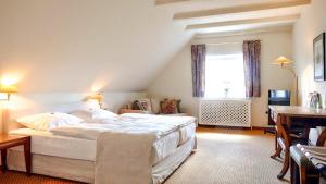 Postel nebo postele na pokoji v ubytování Meyers Hotel Hittfeld