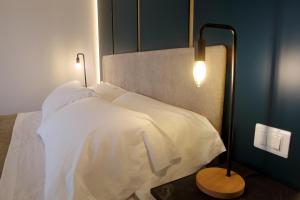 Łóżko lub łóżka w pokoju w obiekcie Mazzini Accommodation