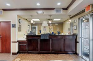a lobby with a reception desk and a mirror at Comfort Inn & Suites Hillsville I-77 in Hillsville +32 photos