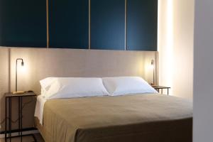 Łóżko lub łóżka w pokoju w obiekcie Mazzini Accommodation