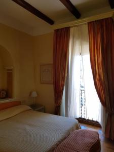 Posteľ alebo postele v izbe v ubytovaní B&B Borgo Antico