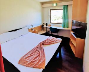 Postel nebo postele na pokoji v ubytování Hotel ibis Leiria Fatima