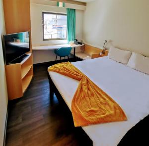 Postel nebo postele na pokoji v ubytování Hotel ibis Leiria Fatima