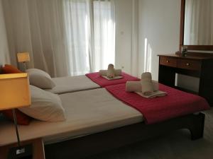 Postel nebo postele na pokoji v ubytování Villa Alexandra Ierissos
