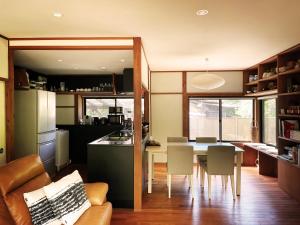 a kitchen and dining room with a table and chairs at Akizuki Niwa (Garden) House in Asakura