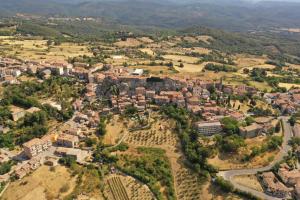 an aerial view of a small town in the hills at Casa Chiassarello con piscina in Roccastrada