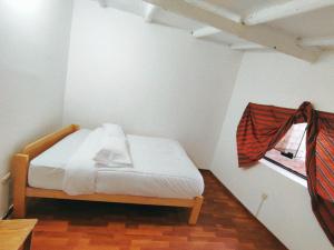 Llit o llits en una habitació de ENEDE HOSTEL