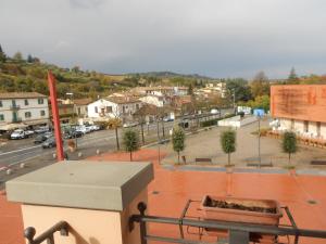 a view of a city from the balcony of a building at Albergo Casa Al Sole in Greve in Chianti