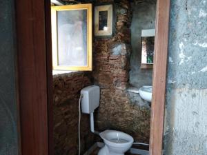 a bathroom with a toilet and a sink at Calabria incontaminata in Gizzeria