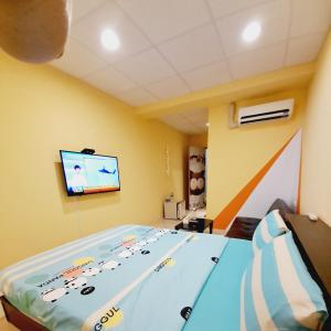 TV in/ali zabaviščno središče v nastanitvi Ming House