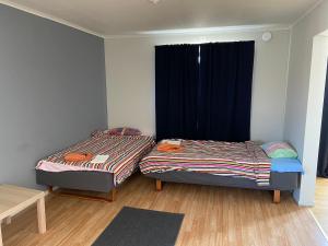 Tempat tidur dalam kamar di Hotel Lapland River