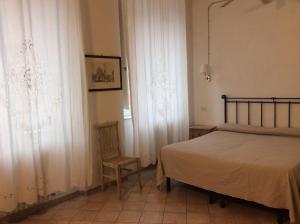 Postel nebo postele na pokoji v ubytování Albergo Cannon d'Oro
