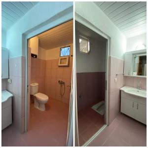 La salle de bains est pourvue d'une douche, de toilettes et d'un lavabo. dans l'établissement Budak Home, à Nevşehir