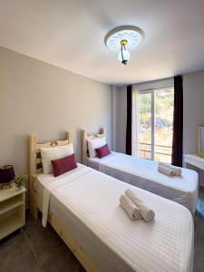 Säng eller sängar i ett rum på Just Dream Suites