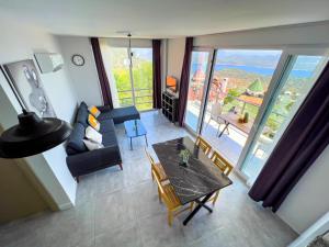 an aerial view of a living room with a table and chairs at Just Dream Suites in Kaş