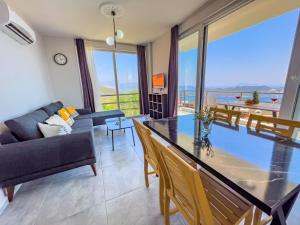 a living room with a table and a couch at Just Dream Suites in Kaş