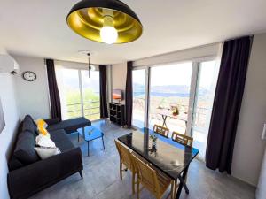 a living room with a couch and a table at Just Dream Suites in Kaş