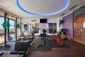 a gym with weights and other equipment in a room at Hotel Adria in Dubrovnik