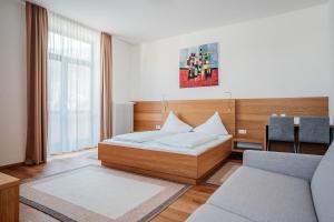 Posteľ alebo postele v izbe v ubytovaní Hotel Vötterl