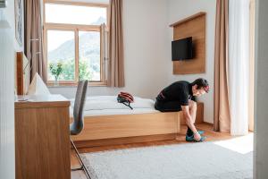 Posteľ alebo postele v izbe v ubytovaní Hotel Vötterl