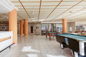 a pool hall with billiard tables in a building at Rethymno Village in Platanes
