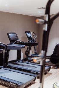 a gym with two tread machines on a treadmill at Elements Hotel&Spa in Świeradów-Zdrój