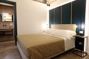 Łóżko lub łóżka w pokoju w obiekcie Mazzini Accommodation