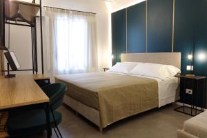 Łóżko lub łóżka w pokoju w obiekcie Mazzini Accommodation