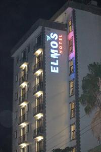a building with a sign on the side of it at Elmos Hotel in Addis Ababa