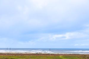 a view of the ocean from the beach at São Félix Seaside Oasis in São Félix da Marinha