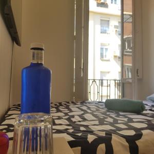 a blue bottle sitting on top of a table at Parque El Retiro Madrid in Madrid